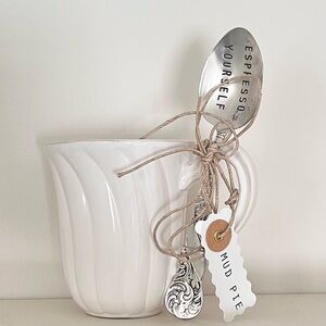 Coffee mug with stirring spoon